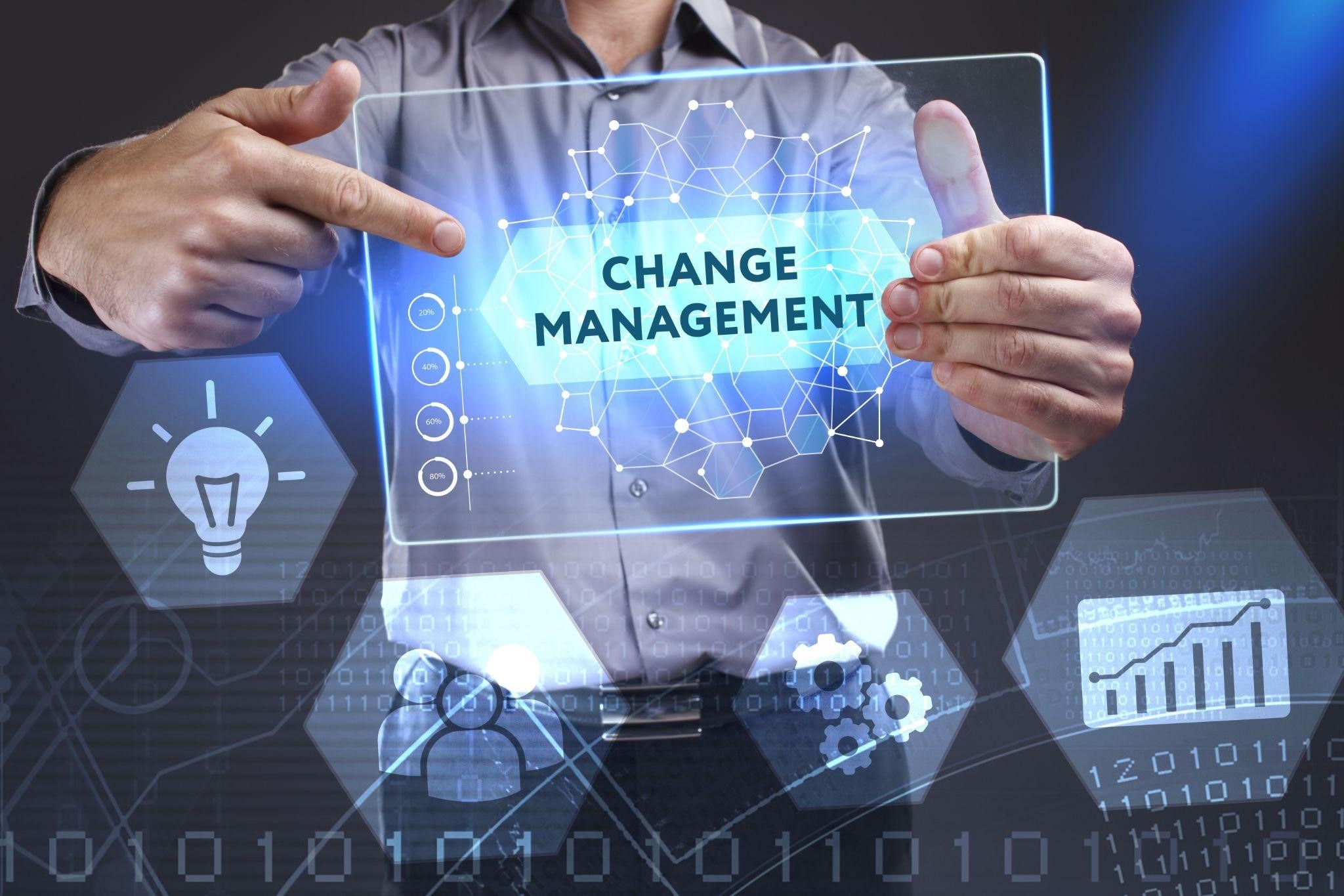 Businessman holding tablet, illustrating Change Management in Construction Industry.